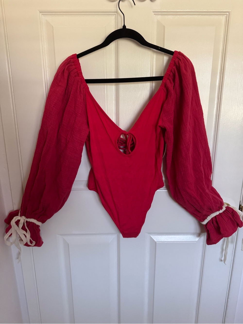 NWT Free People Intimately size medium red long sleeved body suit w/snap crotch.